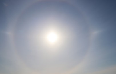 Beautiful view of sun halo in blue sky outdoors