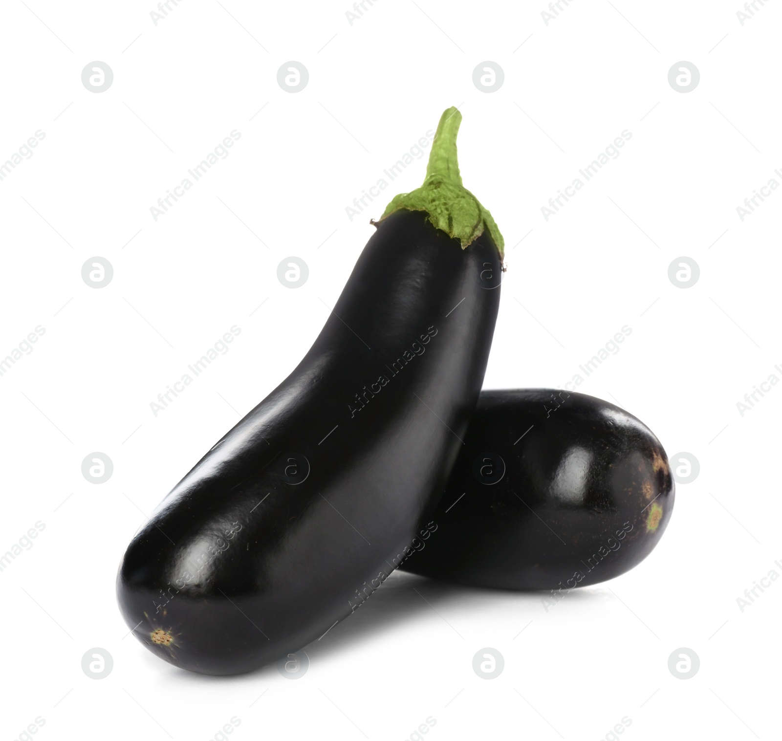 Photo of Tasty raw ripe eggplants on white background