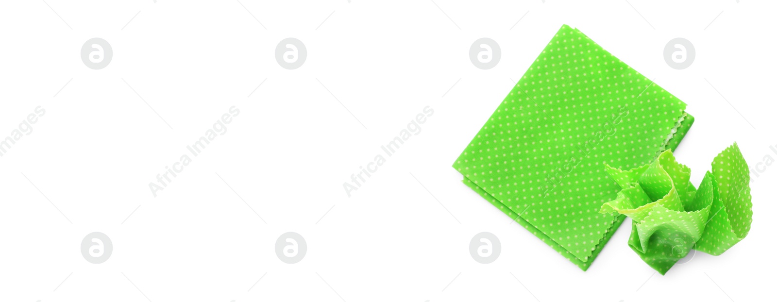 Image of Green beeswax food wraps on white background, top view. Banner design