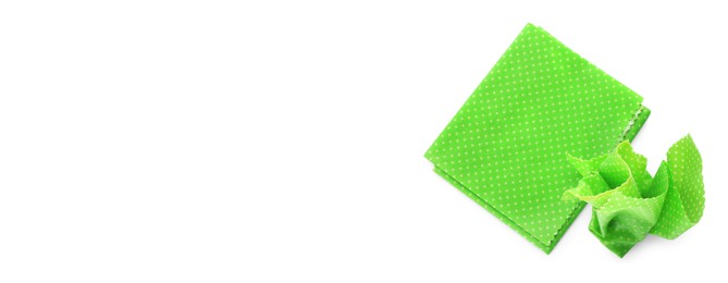 Image of Green beeswax food wraps on white background, top view. Banner design