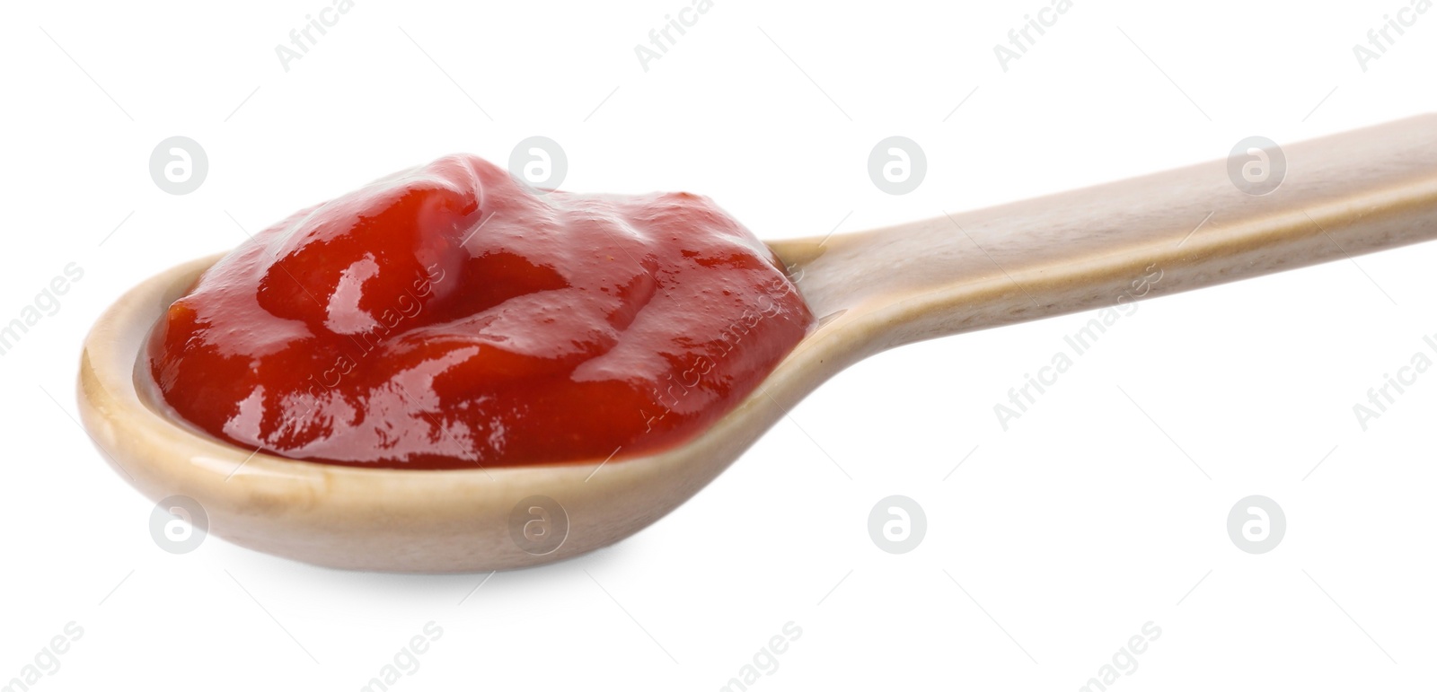 Photo of Spoon with tasty ketchup isolated on white. Tomato sauce