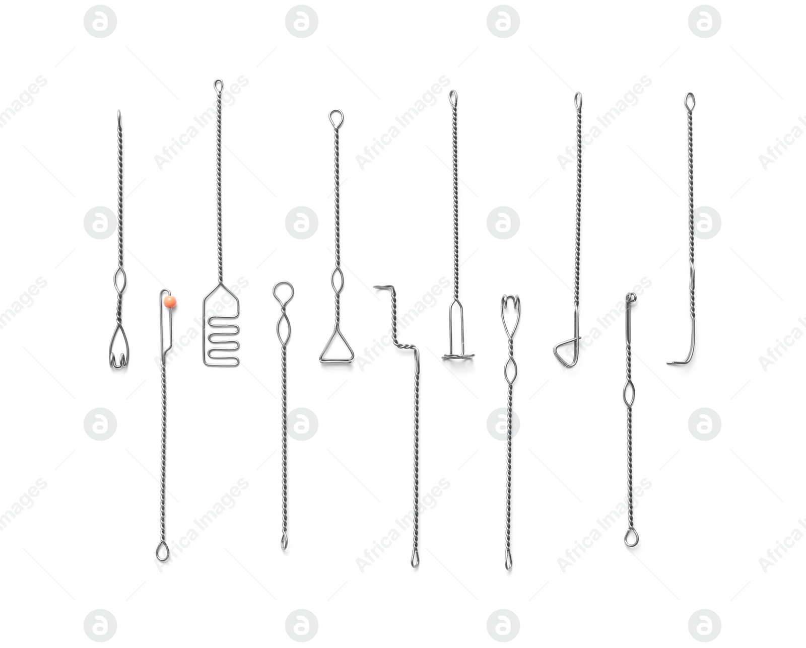 Photo of Set of logopedic probes on white background, top view. Speech therapist's tools