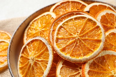 Bowl of dry orange slices, closeup view