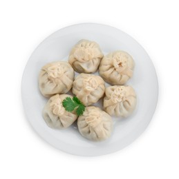 Plate with many tasty khinkali (dumplings) and parsley isolated on white, top view. Georgian cuisine