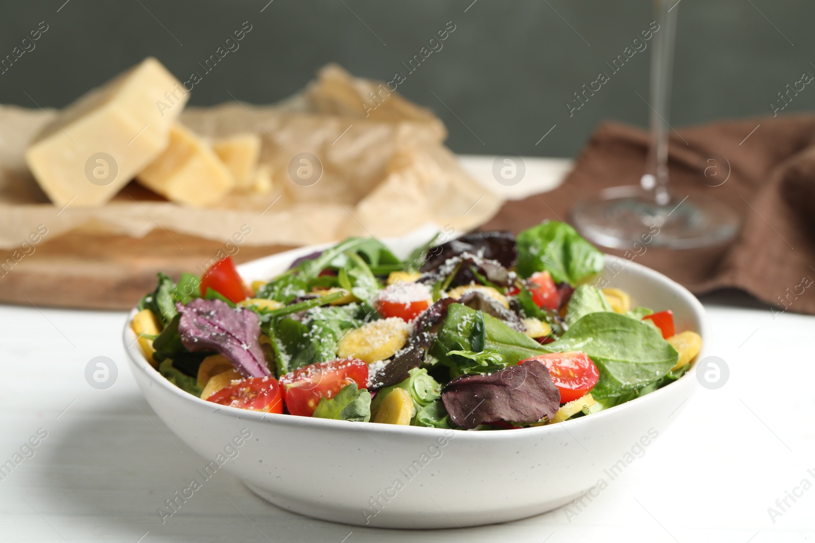 Photo of Delicious fresh carrot salad served on white wooden table, closeup