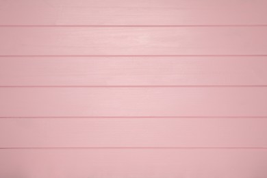 Photo of Texture of pink wooden surface as background, top view