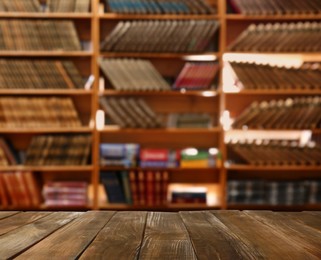 Image of Empty wooden table in library. Space for design 