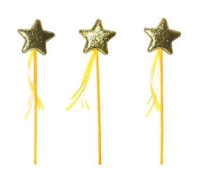 Set with beautiful golden magic wands on white background 