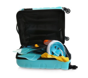 Photo of Open suitcase with beach accessories  on white background