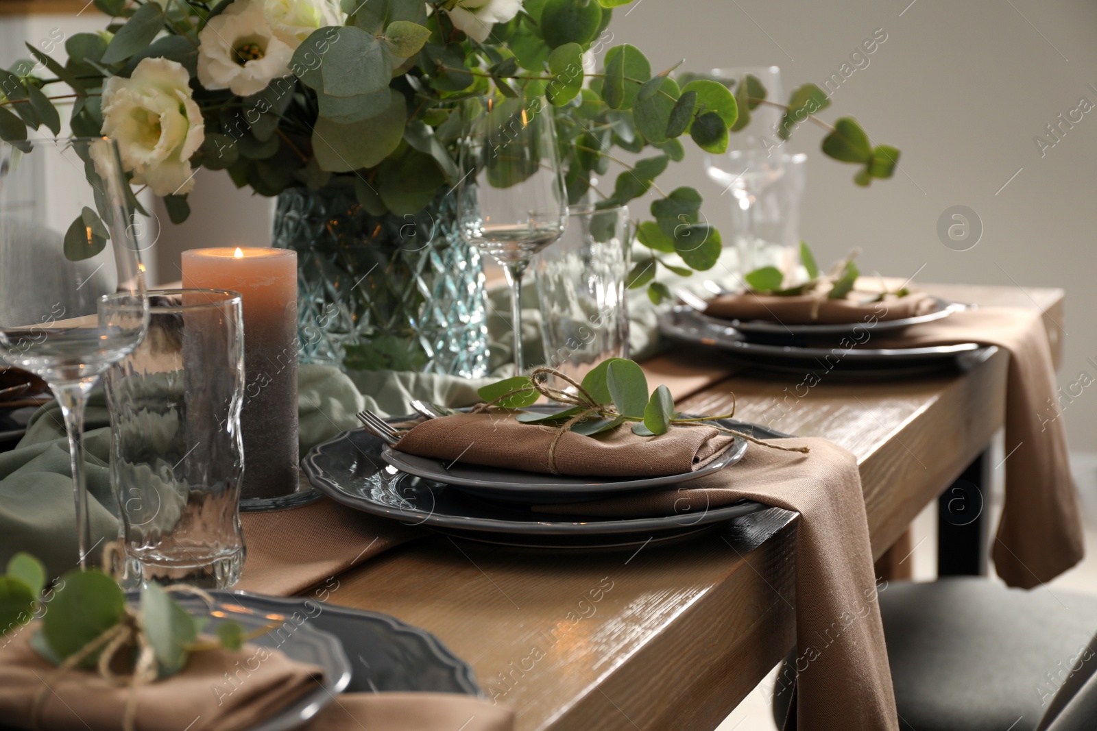 Photo of Festive table setting with beautiful floral decor indoors