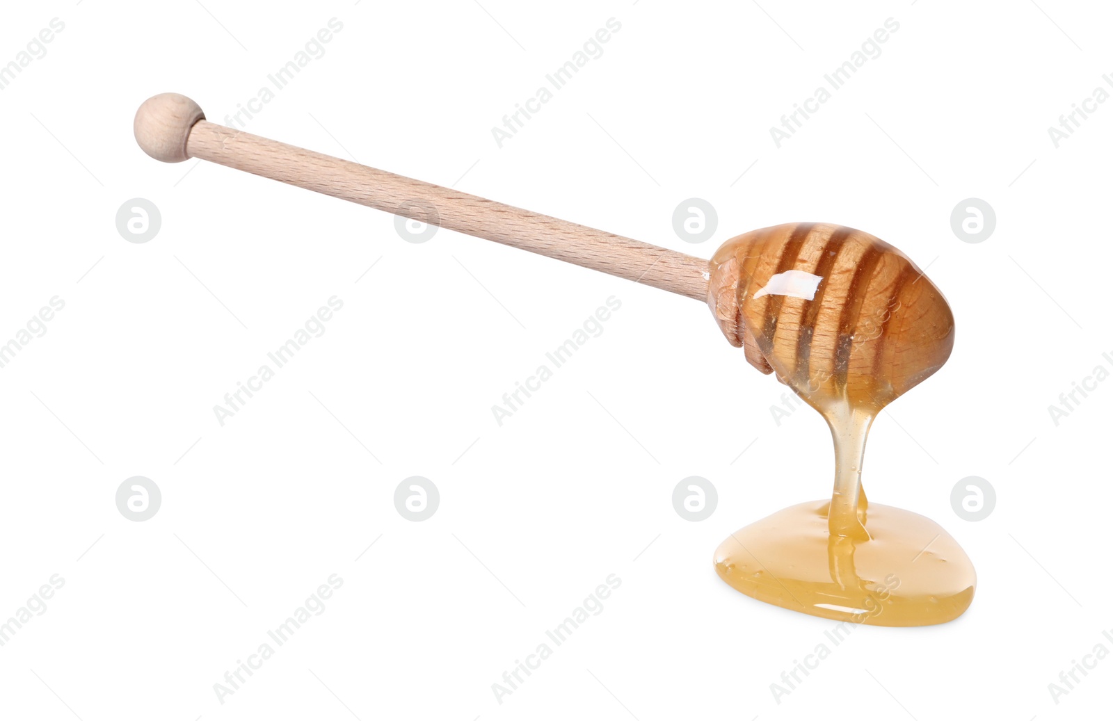 Photo of Natural honey dripping from dipper on white background