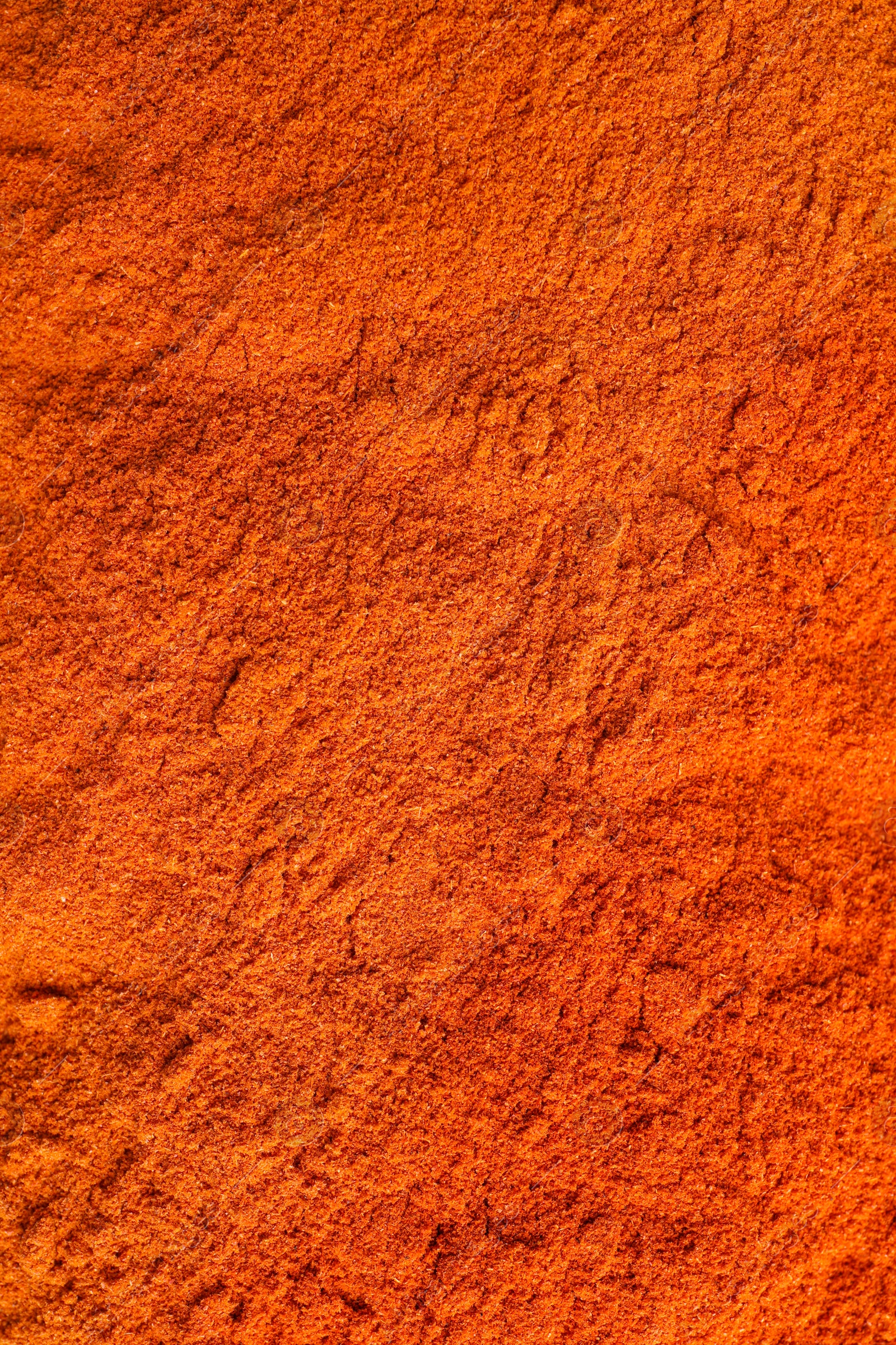 Photo of Aromatic paprika powder as background, top view