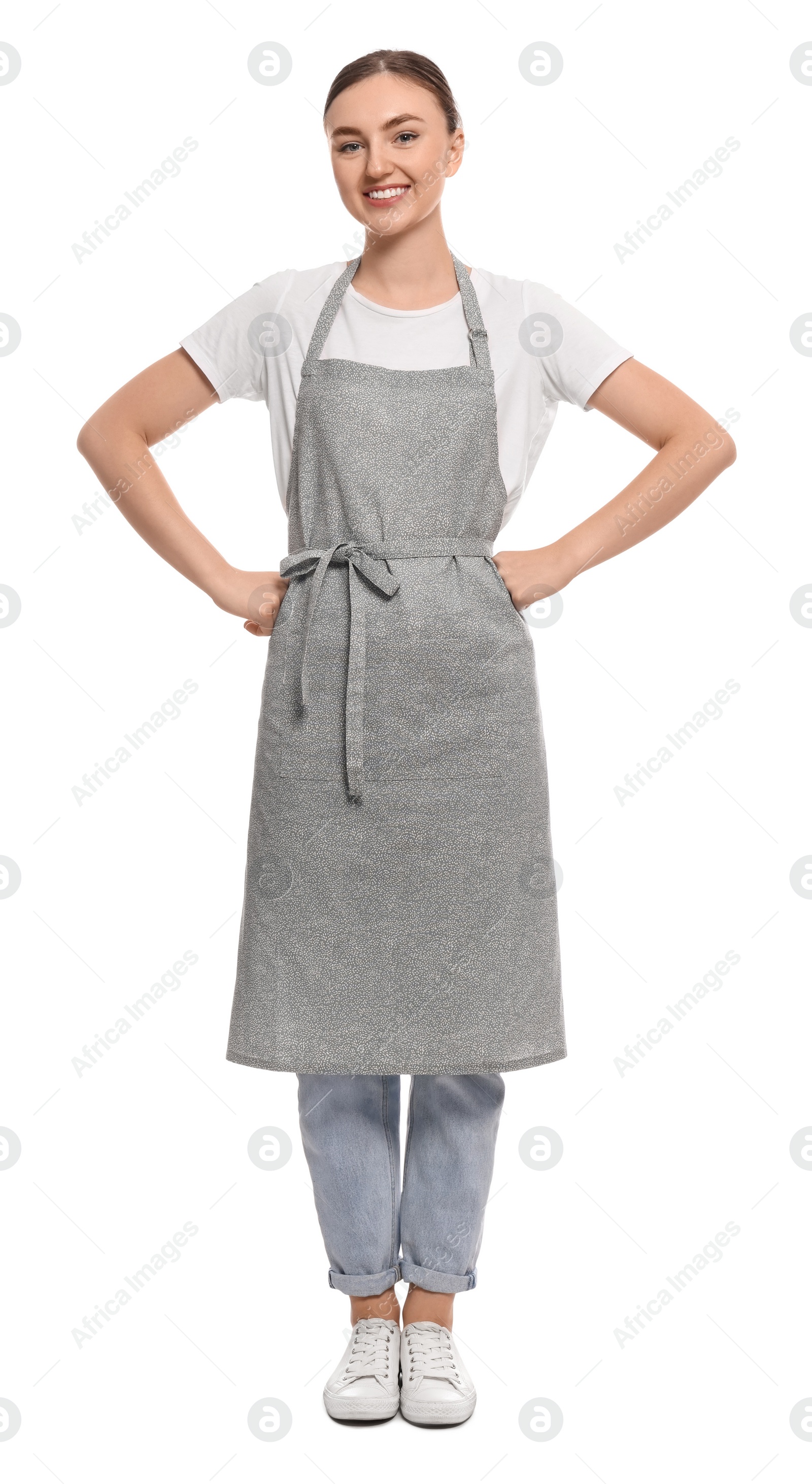 Photo of Beautiful young woman in clean apron on white background