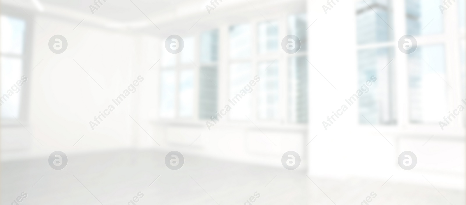 Image of Modern office room with white walls and windows, blurred view. Banner design
