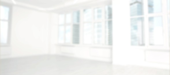Image of Modern office room with white walls and windows, blurred view. Banner design