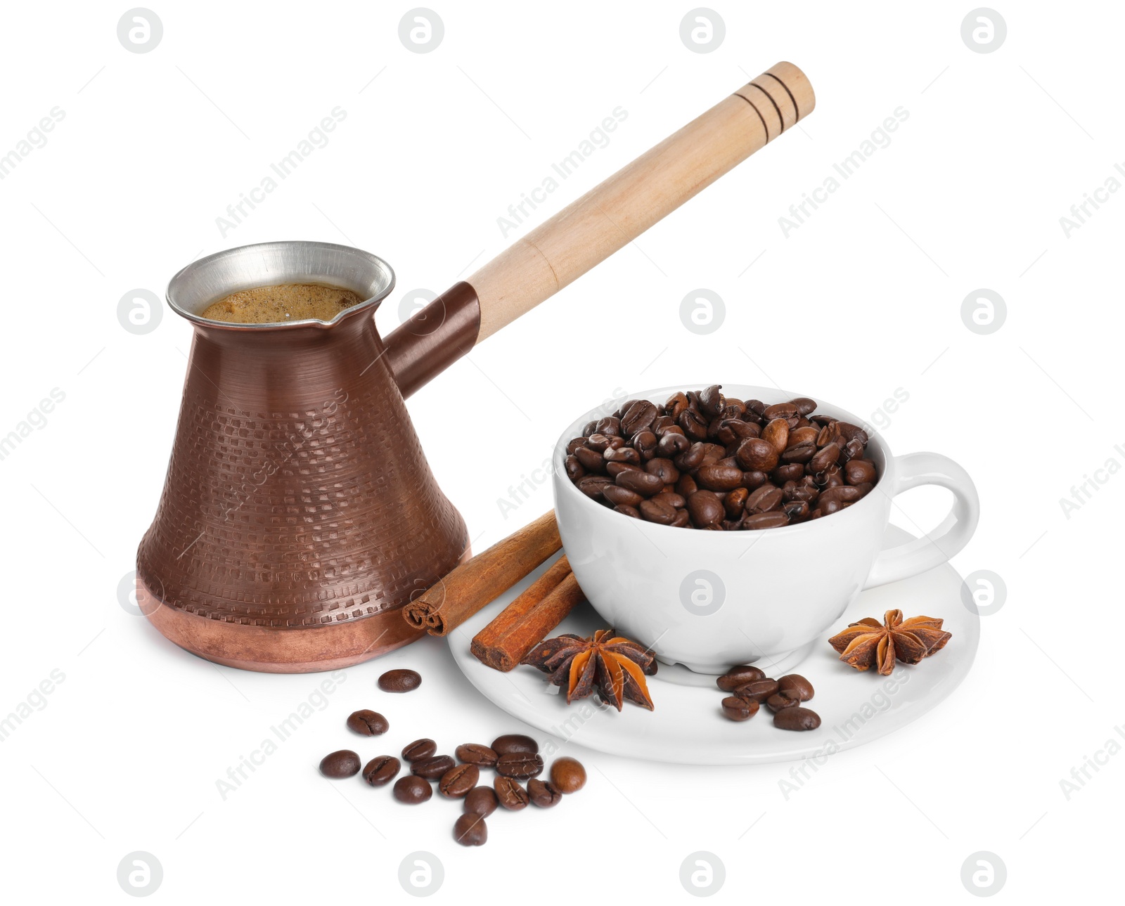 Photo of Metal turkish coffee pot with hot drink, beans and spices on white background