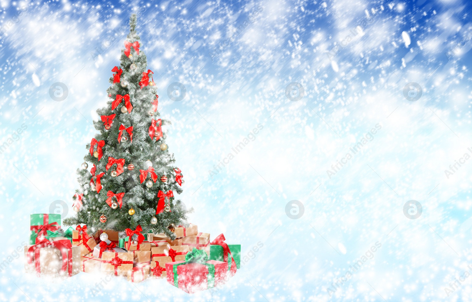 Image of Beautiful Christmas tree with gifts under snowfall, space for text