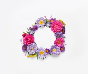 Composition with beautiful aster flowers and blank card on white background, top view. Space for text