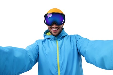 Smiling young man in ski goggles taking selfie on white background