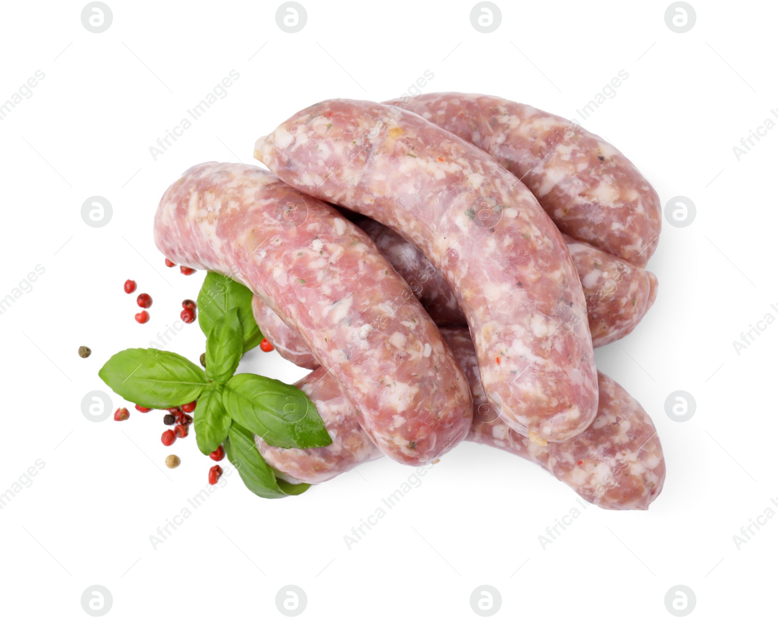 Photo of Raw homemade sausages, basil and spices isolated on white, top view