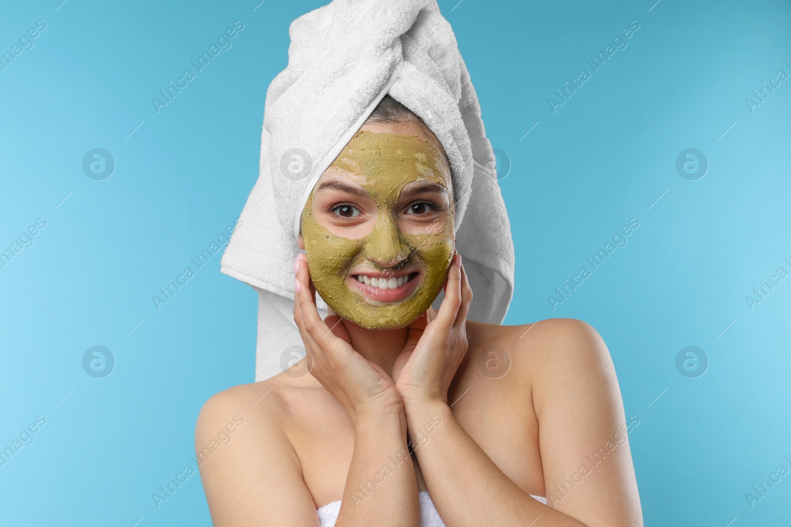 Photo of Beautiful woman with mask on face against color background