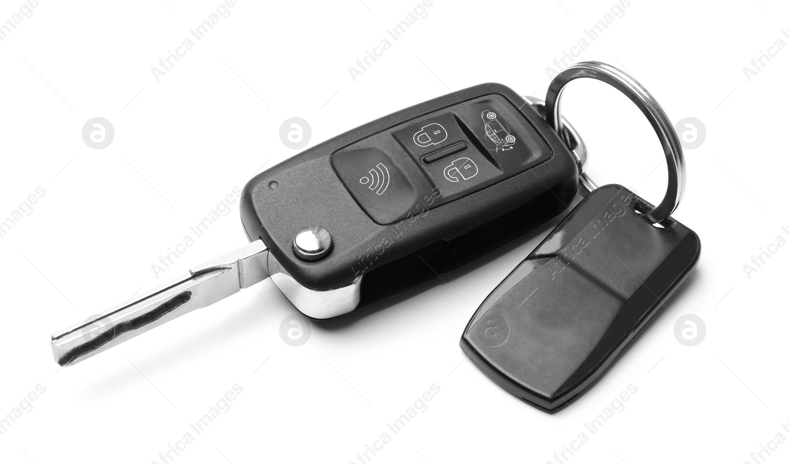 Modern car flip key with trinket isolated on white Photo of Modern car flip key with trinket isolated on white