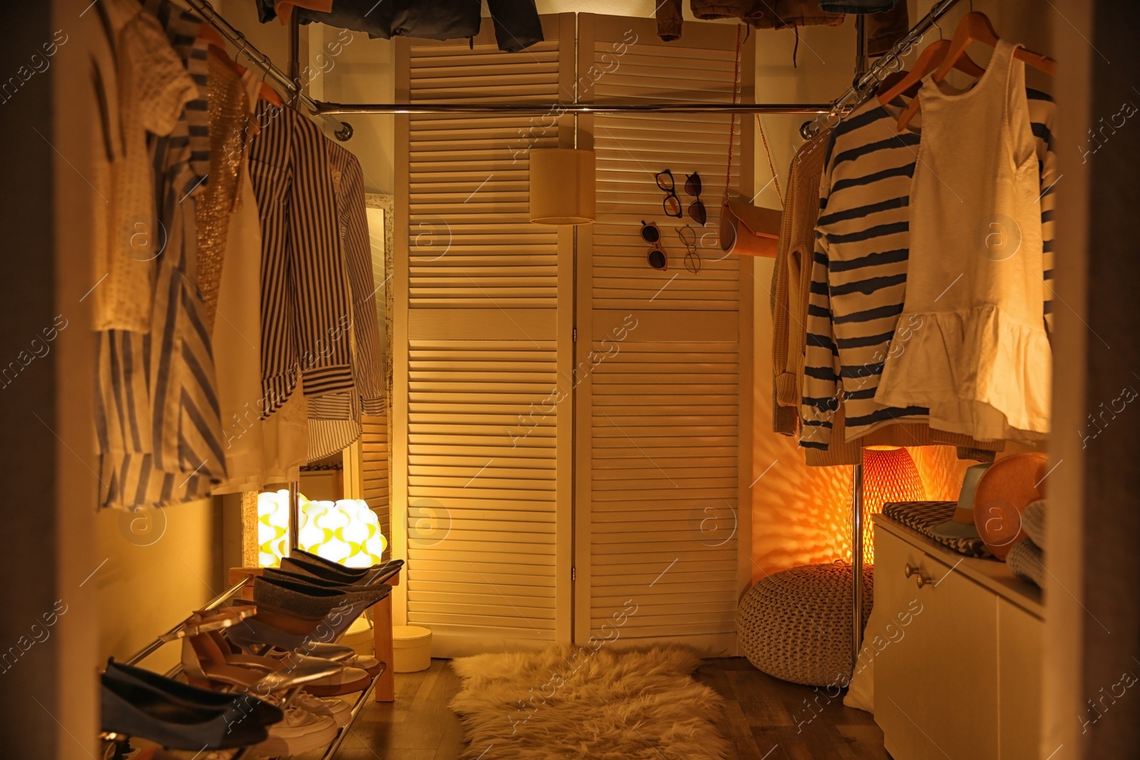 Photo of Modern dressing room with different stylish clothes and accessories