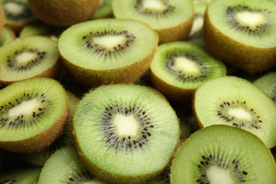 Halves of fresh kiwis as background, closeup