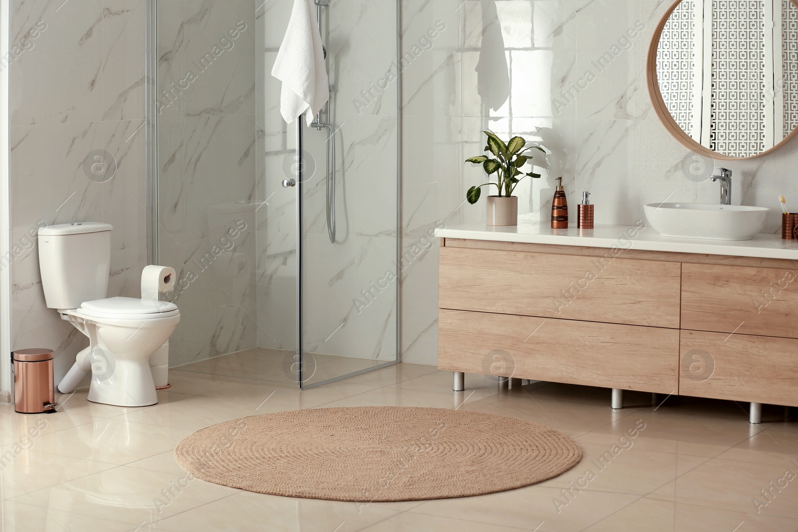 Photo of Interior of modern bathroom with toilet bowl