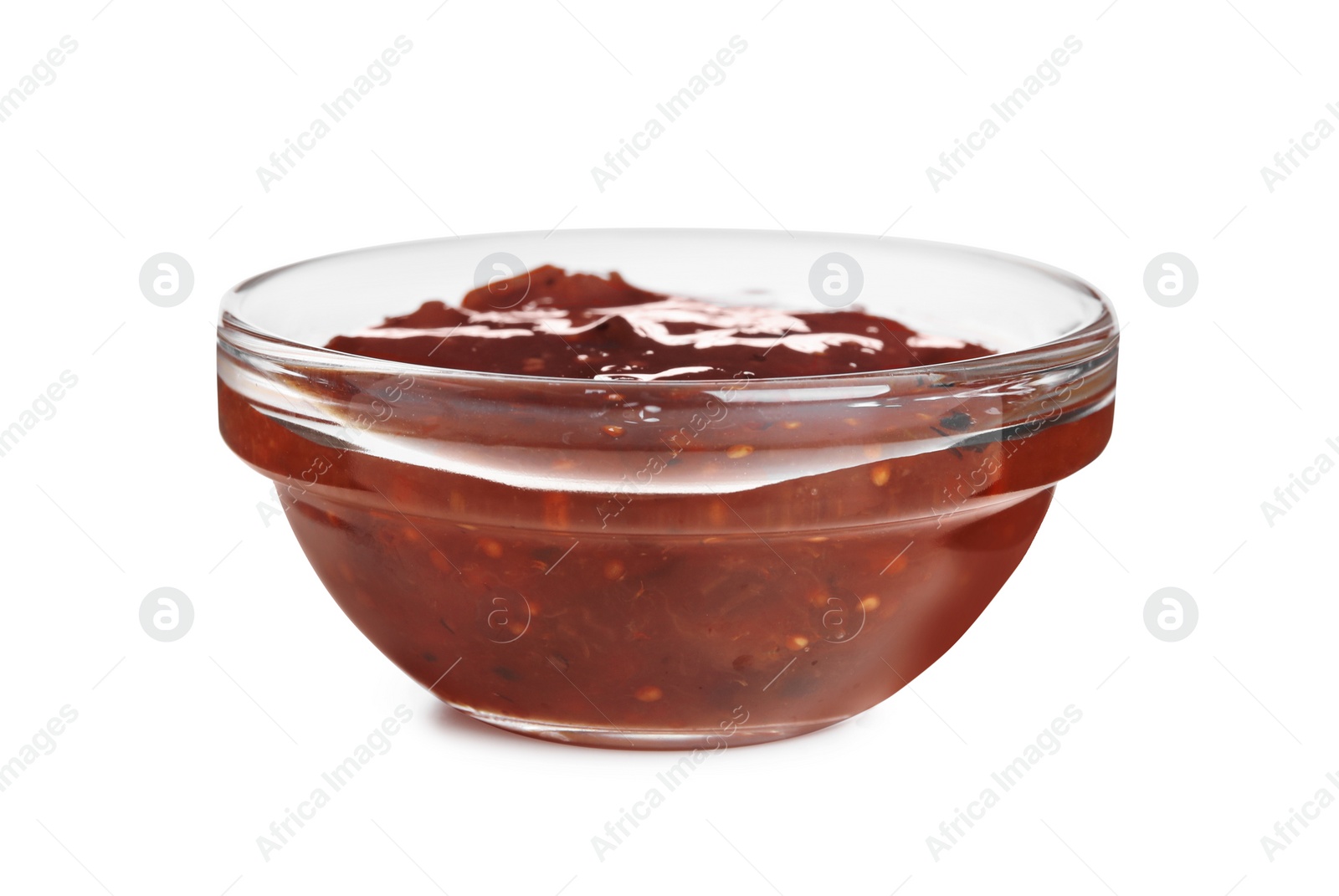 Photo of Glass bowl of tasty sweet fig jam isolated on white
