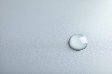 Beautiful clean water drop on light background