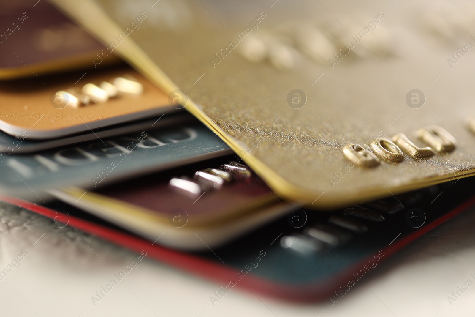 Photo of Plastic credit cards on table, macro view