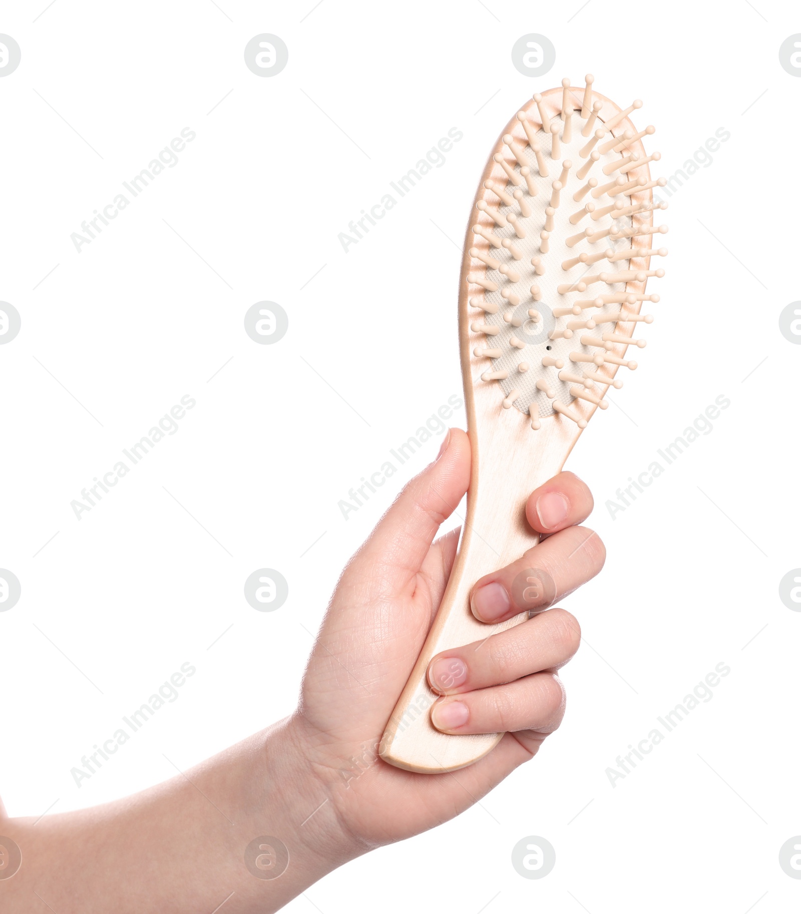 Photo of Woman holding hair brush on white background, closeup