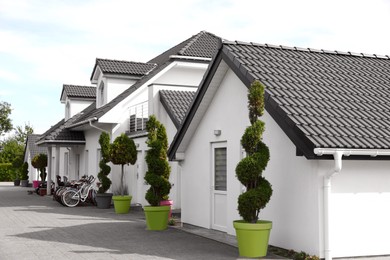 Photo of Exterior of beautiful modern white houses outdoors