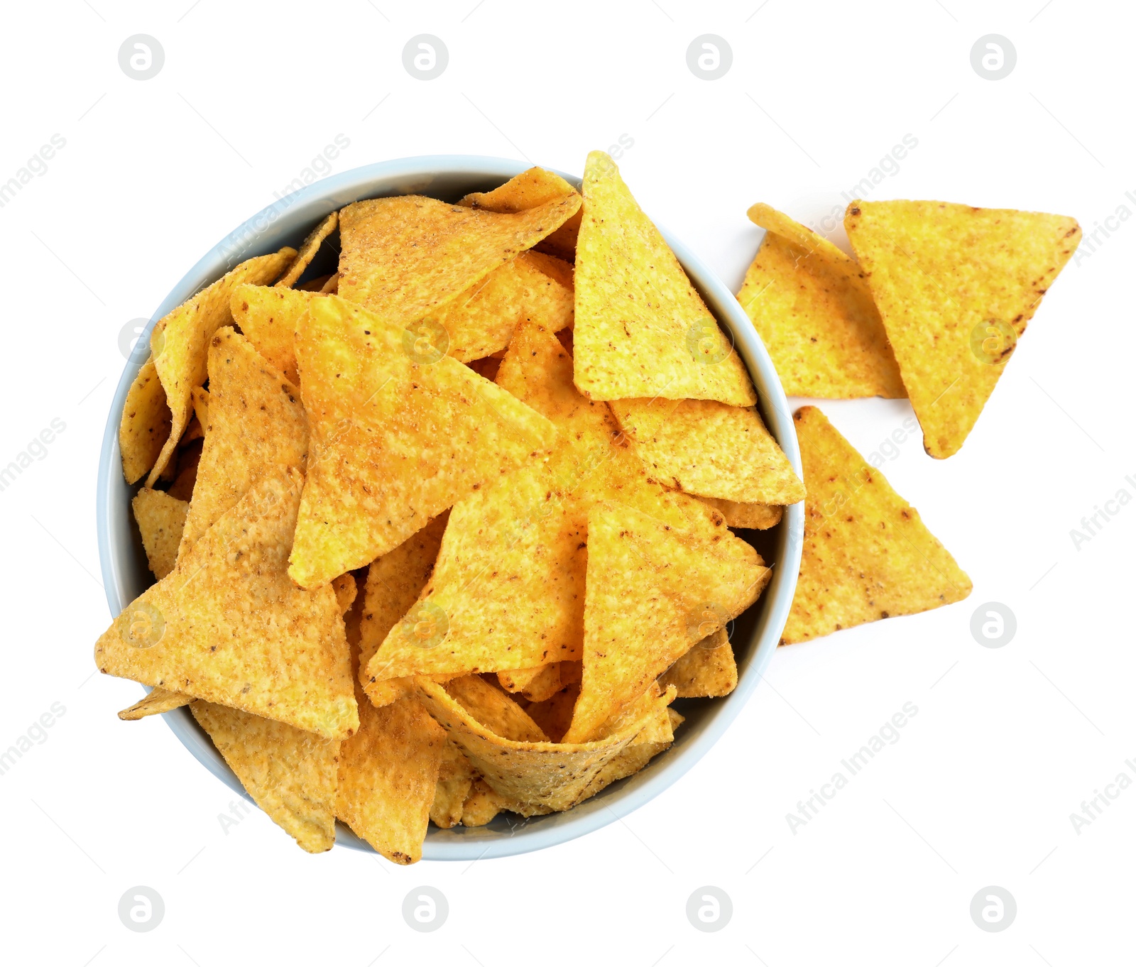 Photo of Bowl with tasty Mexican nachos chips on white background, top view