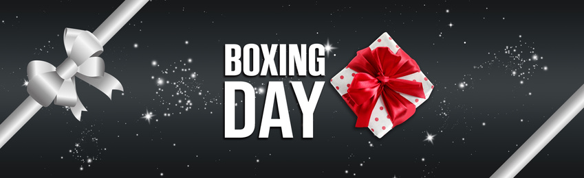 Image of Text Boxing Day and gift on dark background with ribbon. Banner design