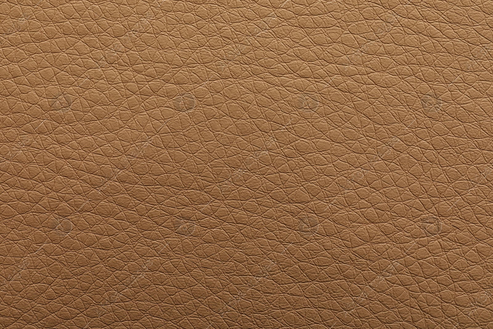 Photo of Texture of light brown leather as background, closeup