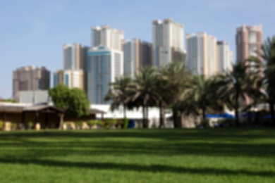 SHARJAH, UNITED ARAB EMIRATES - NOVEMBER 04, 2018: Blurred view of landscape with green park and tropical resort