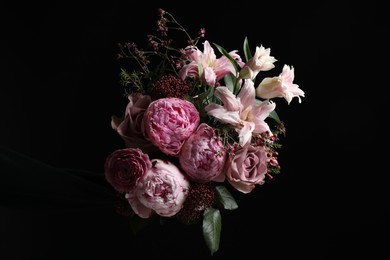 Photo of Beautiful bouquet of different flowers on dark background