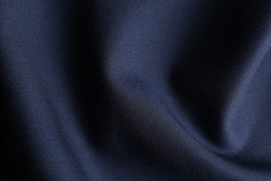 Photo of Texture of dark blue fabric as background, closeup