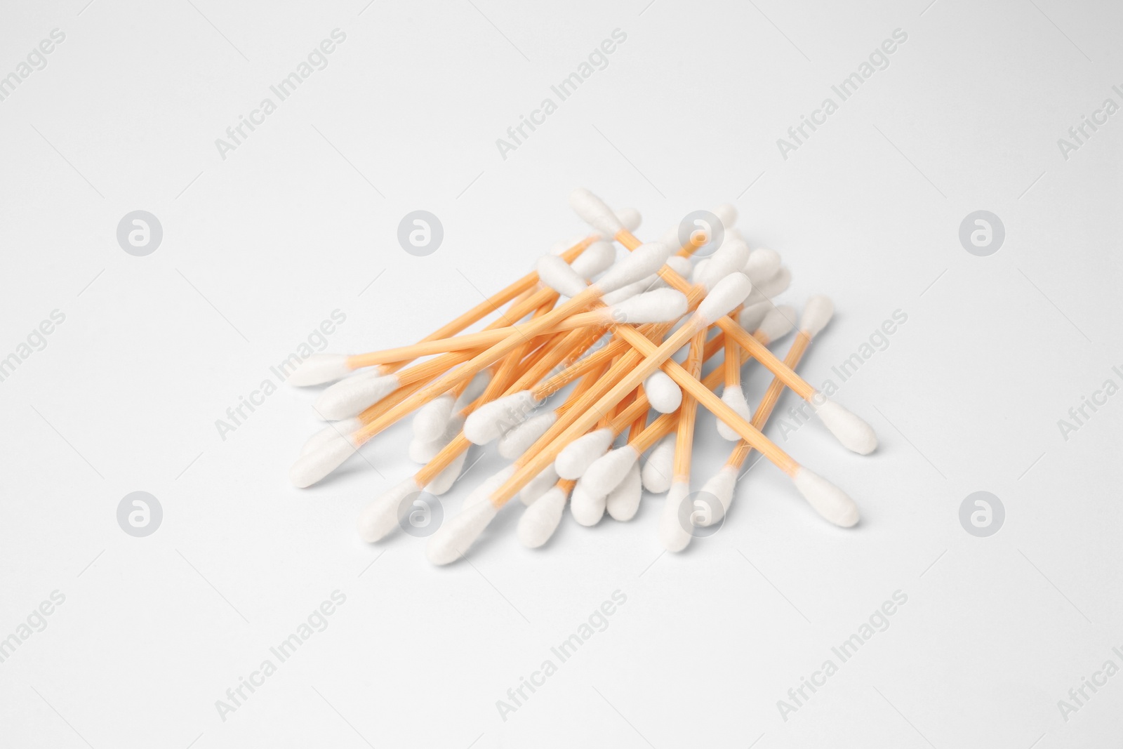 Photo of Pile of clean cotton buds isolated on white