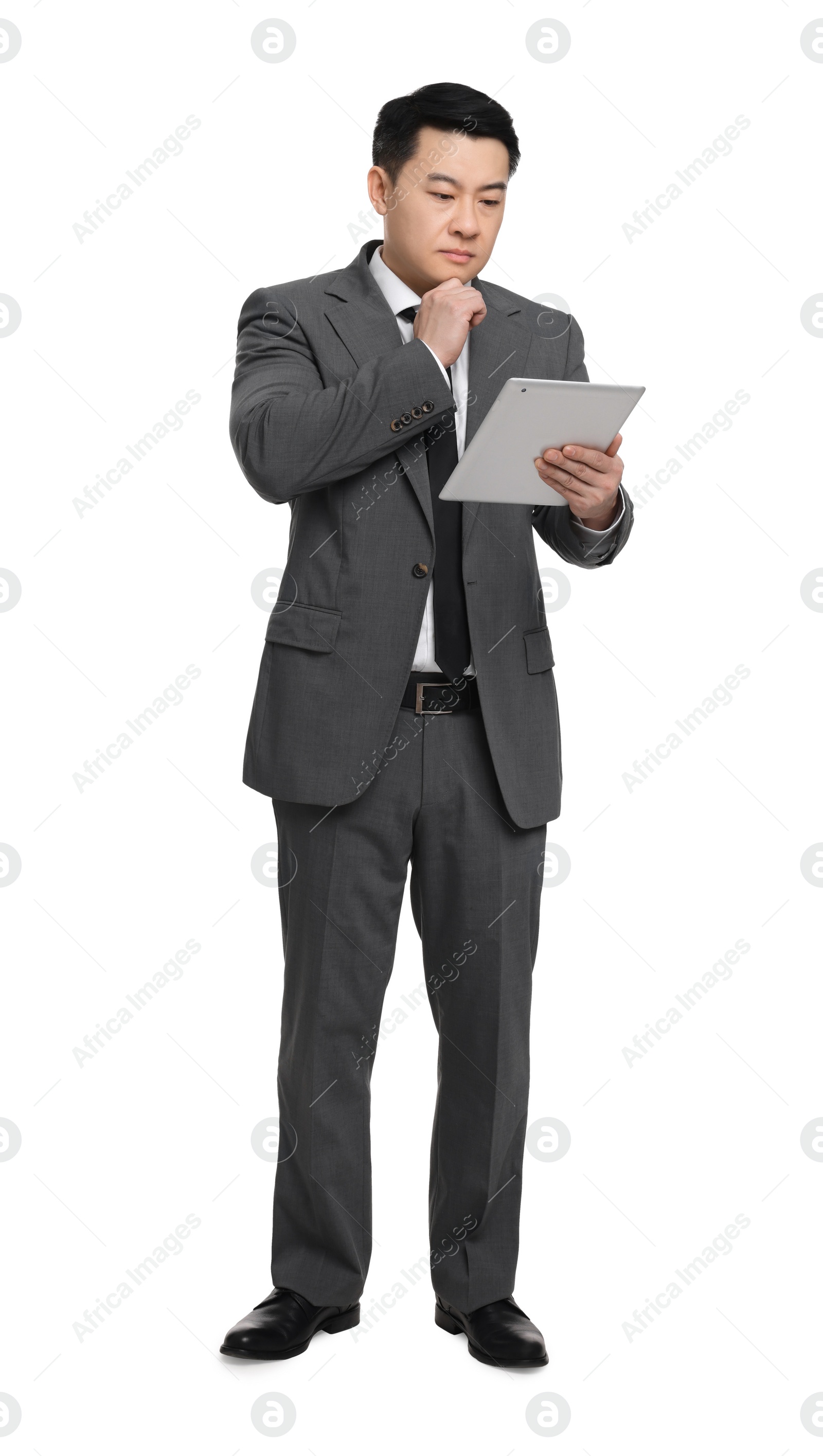 Photo of Businessman in suit using tablet on white background