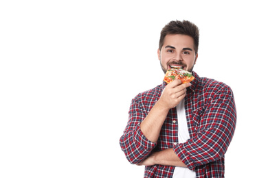 Photo of Handsome man eating pizza isolated on white