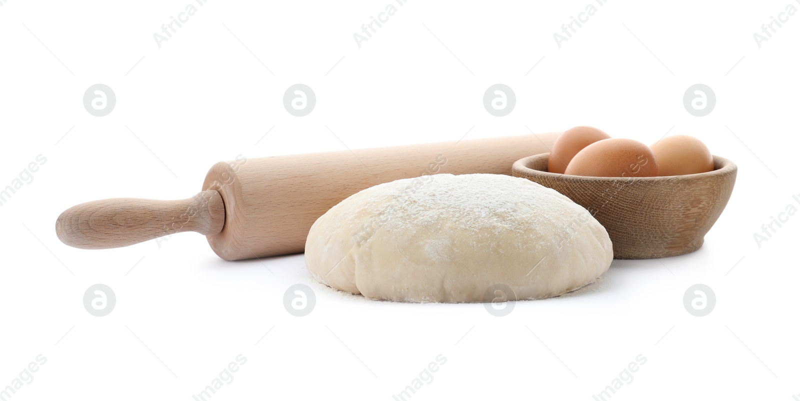 Photo of Dough, eggs and rolling pin on white background. Cooking pastries