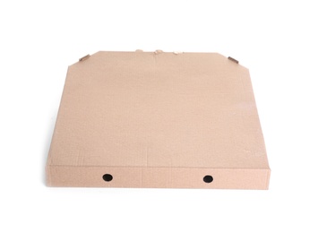 Photo of Cardboard pizza box on white background. Mockup for design