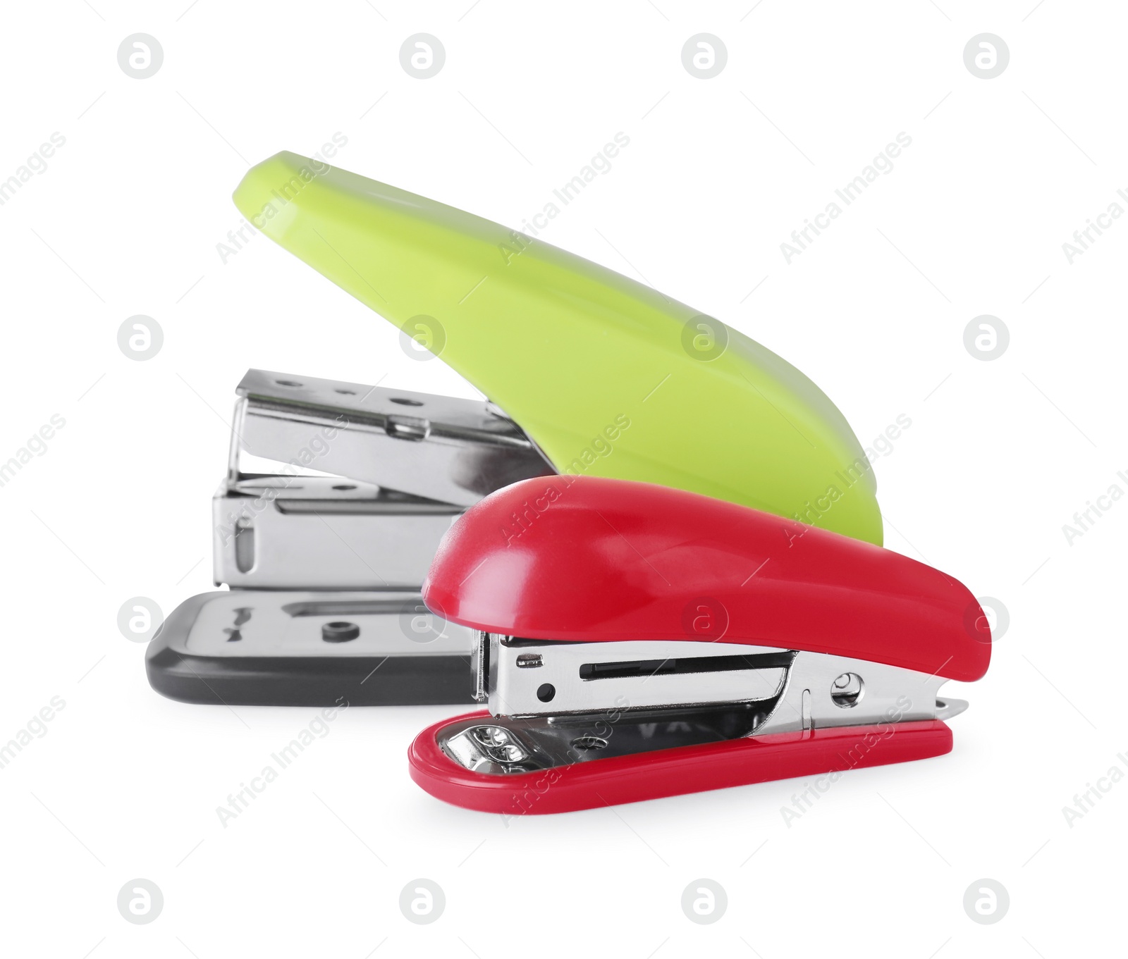 Photo of New bright color staplers isolated on white