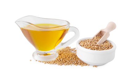 Photo of Jug of natural oil and mustard seeds on white background