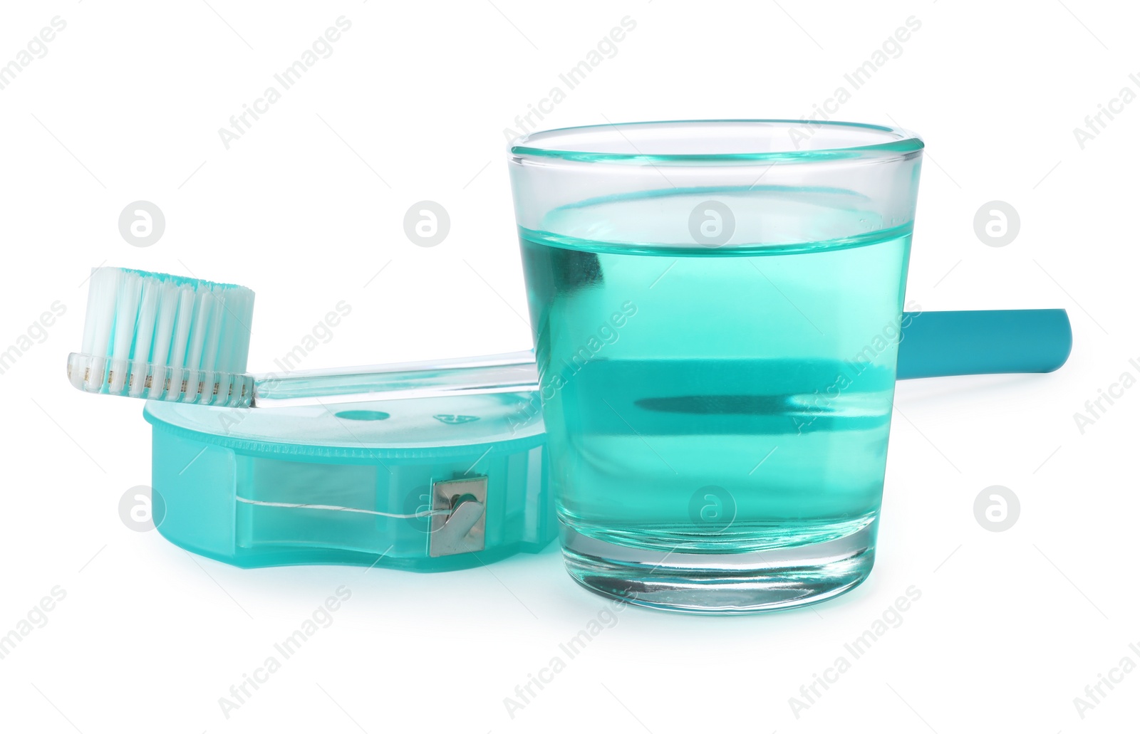 Photo of Mouthwash and other items for teeth care on white background