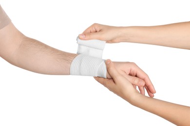 Photo of Doctor applying medical bandage onto patient's hand on white background, closeup