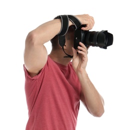 Young professional photographer taking picture on white background